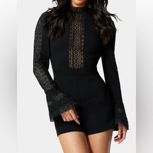 bebe Black Ruffle Bell Sleeve Romper size S